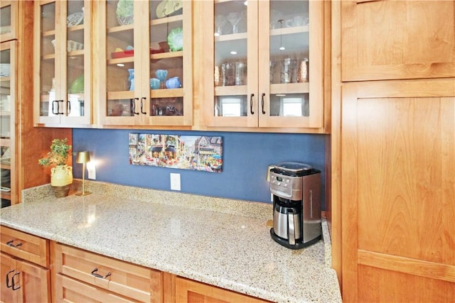 3403 Double Eagle Ln, Opelika, AL 36801 - kitchen with light stone counters and glass insert cabinets