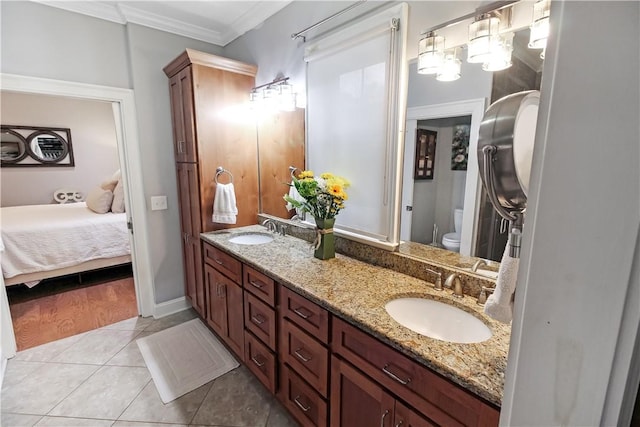 3403 Double Eagle Ln, Opelika, AL 36801 - full bath with double vanity, ornamental molding, tile patterned floors, and toilet