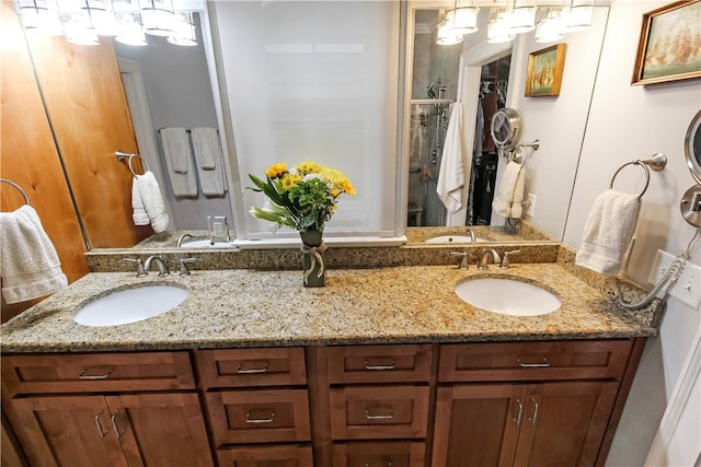 3403 Double Eagle Ln, Opelika, AL 36801 - bathroom featuring double vanity, a chandelier, and a closet