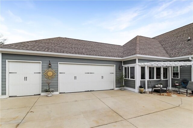 3403 Double Eagle Ln, Opelika, AL 36801 - view of front of home with a shingled roof, concrete driveway, a garage, and a pergola