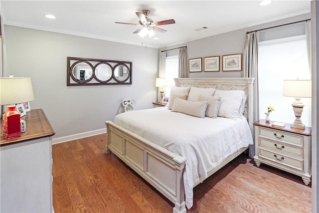 3403 Double Eagle Ln, Opelika, AL 36801 - bedroom with wood finished floors, baseboards, recessed lighting, ceiling fan, and ornamental molding