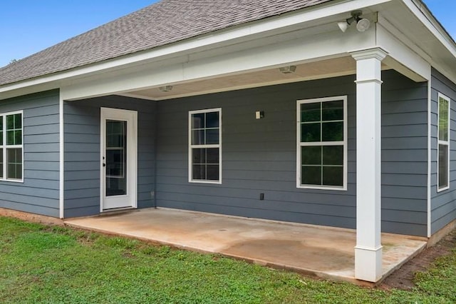 1431 Lowndes St, Opelika, AL 36801 - back of property with a patio area and roof with shingles