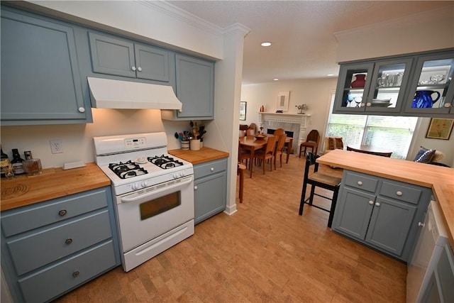 kitchen featuring crown molding, white appliances, under cabinet range hood, wood counters, and light wood finished floors