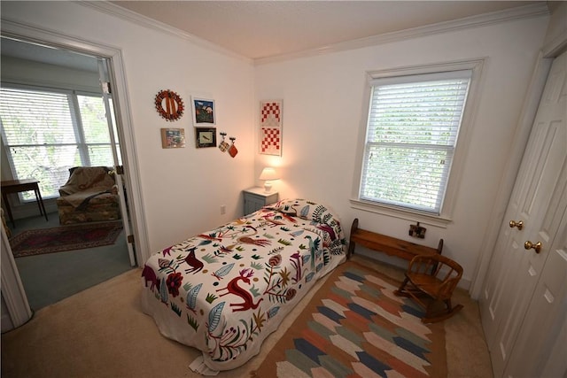 bedroom with carpet floors and ornamental molding