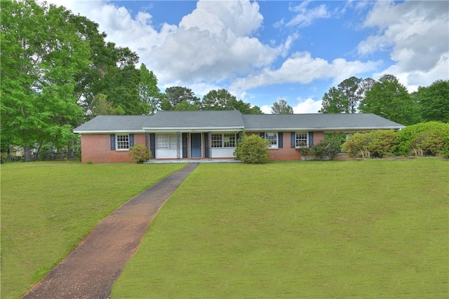 ranch-style home with a front lawn