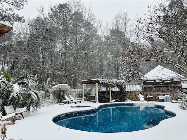 snow covered pool featuring a gazebo