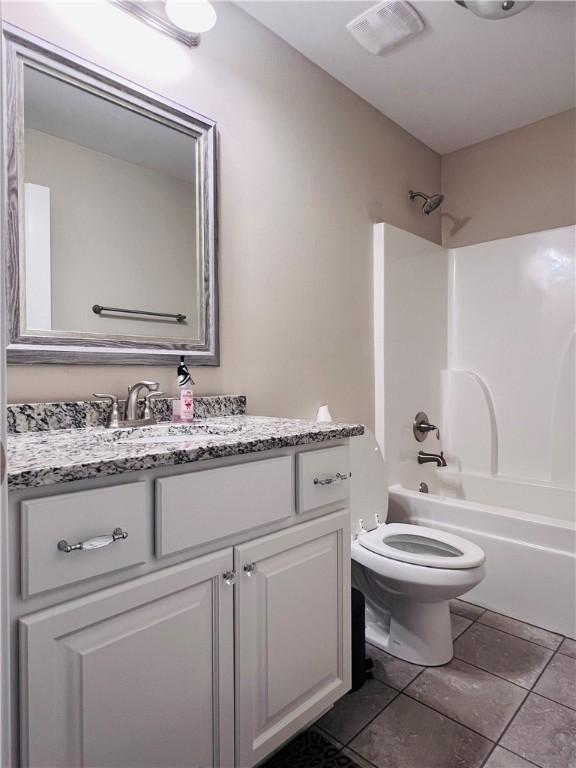 1024 Hampstead Ln, Opelika, AL 36801 - bathroom with vanity, tub / shower combination, and tile patterned floors