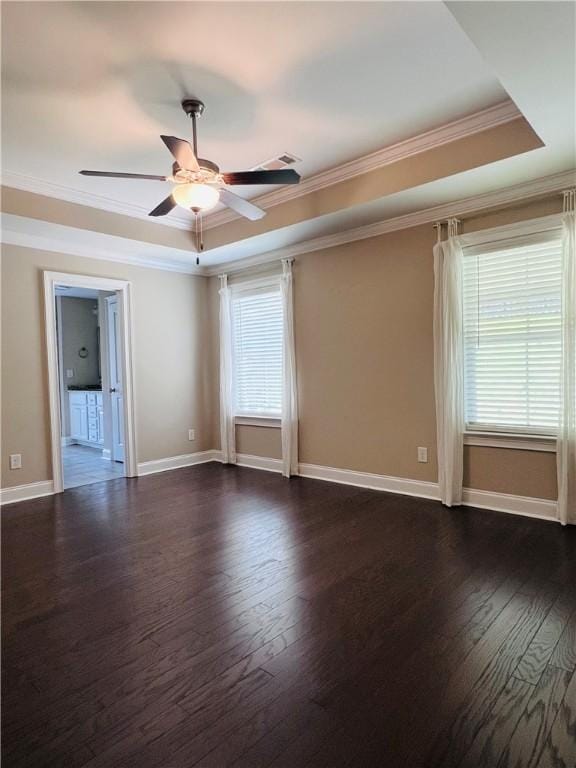 1024 Hampstead Ln, Opelika, AL 36801 - unfurnished room featuring a raised ceiling, crown molding, ceiling fan, and dark wood finished floors