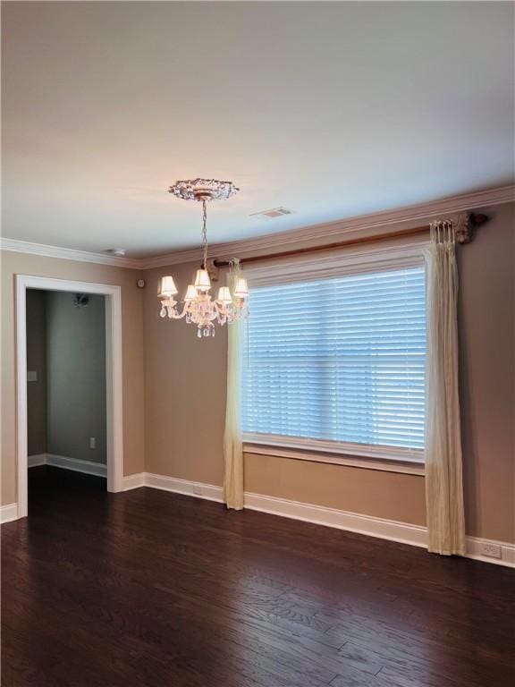 1024 Hampstead Ln, Opelika, AL 36801 - spare room featuring a chandelier, dark wood finished floors, and crown molding
