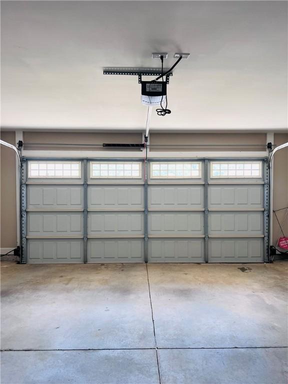 1024 Hampstead Ln, Opelika, AL 36801 - garage featuring a garage door opener