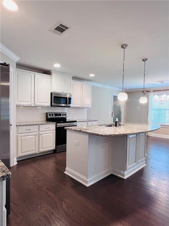 1024 Hampstead Ln, Opelika, AL 36801 - kitchen featuring stainless steel appliances, dark wood-style flooring, light stone counters, ornamental molding, and recessed lighting