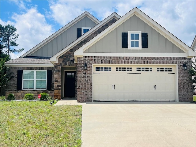 1024 Hampstead Ln, Opelika, AL 36801 - craftsman-style home featuring board and batten siding, driveway, and brick siding