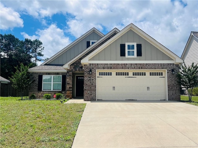 1024 Hampstead Ln, Opelika, AL 36801 - craftsman-style home with board and batten siding, concrete driveway, brick siding, a front yard, and a garage
