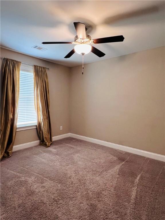 1024 Hampstead Ln, Opelika, AL 36801 - spare room with carpet flooring and a ceiling fan
