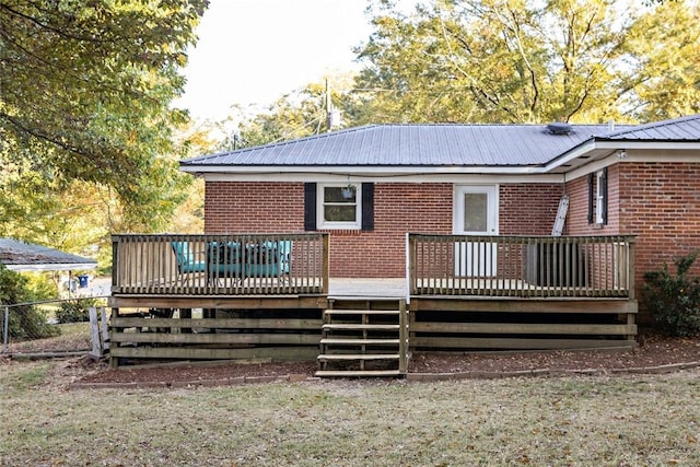 back of house with a wooden deck