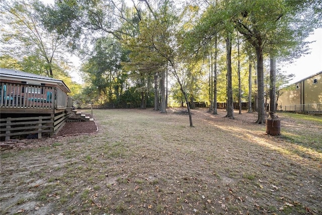 view of yard featuring a deck