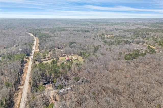 bird's eye view featuring a wooded view