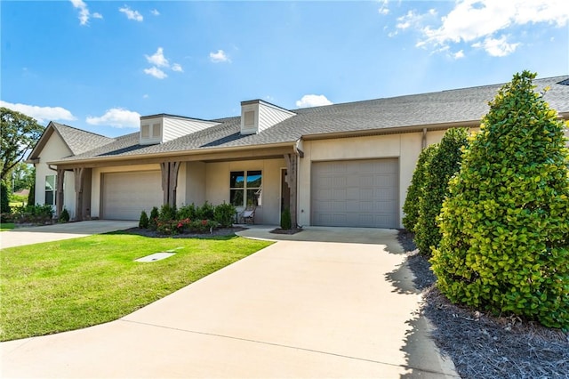 ranch-style home with a front yard and a garage