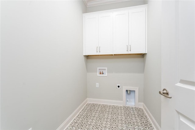 laundry area featuring hookup for an electric dryer, washer hookup, crown molding, and cabinets