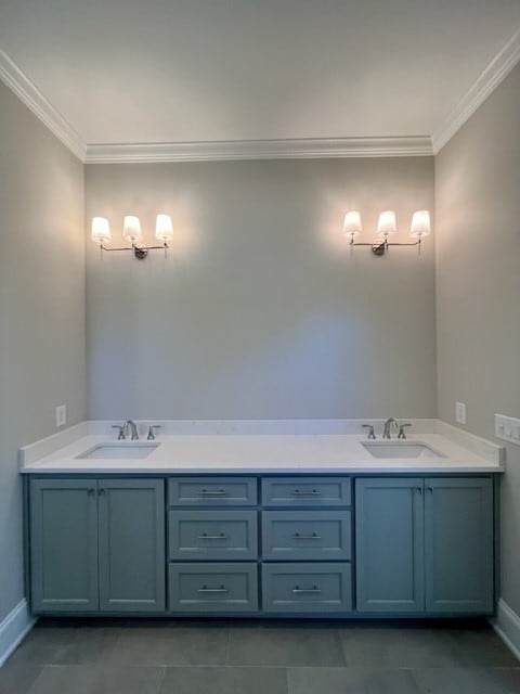 bathroom with tile patterned floors, vanity, and ornamental molding