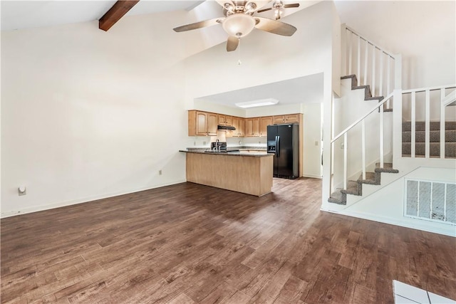 283 Ivy Ln, Auburn, AL 36830 - unfurnished living room with dark wood-style floors, stairway, a ceiling fan, beamed ceiling, and high vaulted ceiling