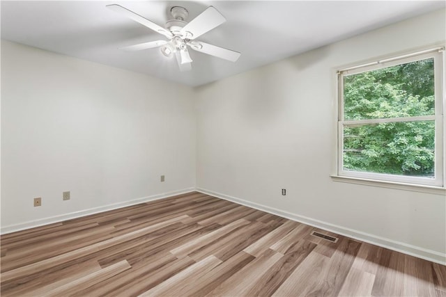 283 Ivy Ln, Auburn, AL 36830 - empty room with wood finished floors and ceiling fan