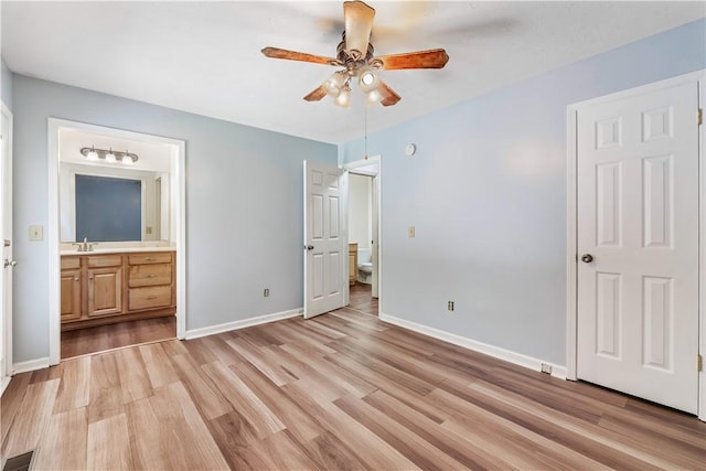 283 Ivy Ln, Auburn, AL 36830 - unfurnished bedroom featuring light wood-style floors, ensuite bath, and a ceiling fan