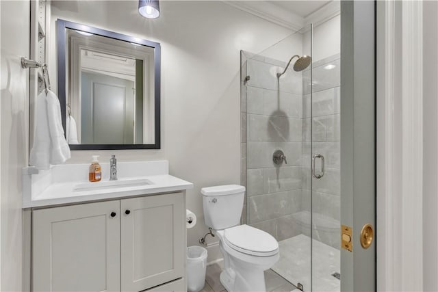 full bathroom with a stall shower, vanity, and toilet