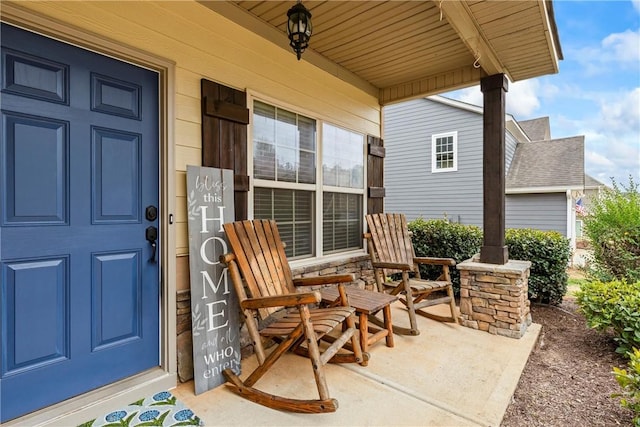 property entrance with covered porch