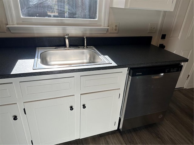 kitchen with dishwasher, sink, a healthy amount of sunlight, dark hardwood / wood-style flooring, and white cabinets