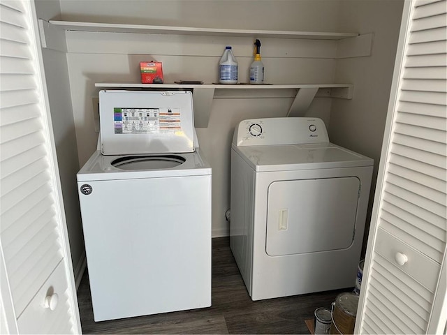 laundry area with washer and clothes dryer and dark hardwood / wood-style floors