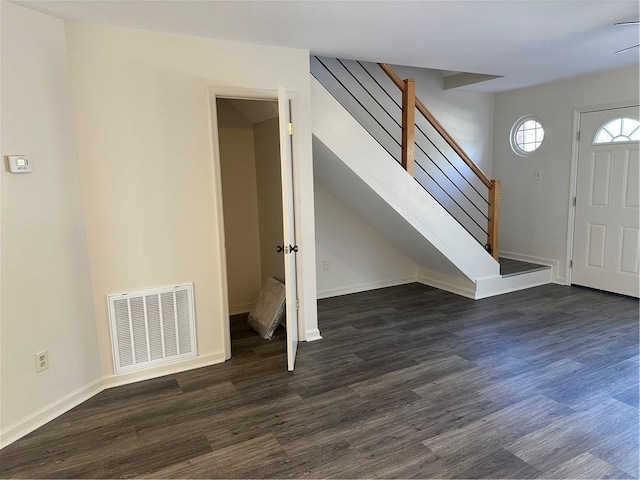 foyer featuring dark wood-type flooring