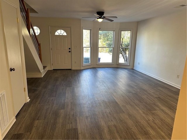 entryway with ceiling fan, dark wood-type flooring, and a healthy amount of sunlight