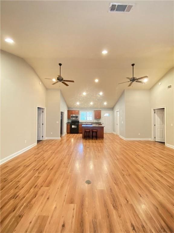 807 W Longleaf Dr Unit 92, Auburn, AL 36832 - unfurnished living room with ceiling fan, light wood finished floors, baseboards, recessed lighting, and high vaulted ceiling