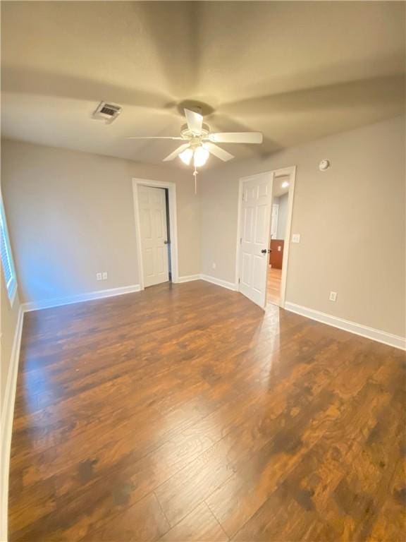 807 W Longleaf Dr Unit 92, Auburn, AL 36832 - empty room with ceiling fan, dark wood finished floors, and baseboards