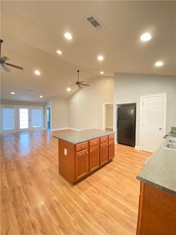 807 W Longleaf Dr Unit 92, Auburn, AL 36832 - kitchen with a ceiling fan, light wood-style floors, brown cabinets, and recessed lighting