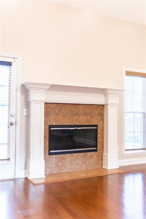 interior details featuring a fireplace and hardwood / wood-style floors