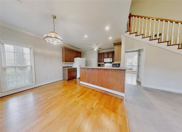 3666 Hawks Lndg, Auburn, AL 36804 - kitchen with white appliances, light countertops, ornamental molding, decorative light fixtures, and recessed lighting