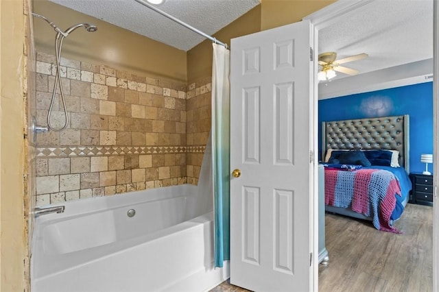 1417 Ridge Rd, Opelika, AL 36801 - ensuite bathroom featuring shower / bath combination with curtain, a textured ceiling, a ceiling fan, and wood finished floors