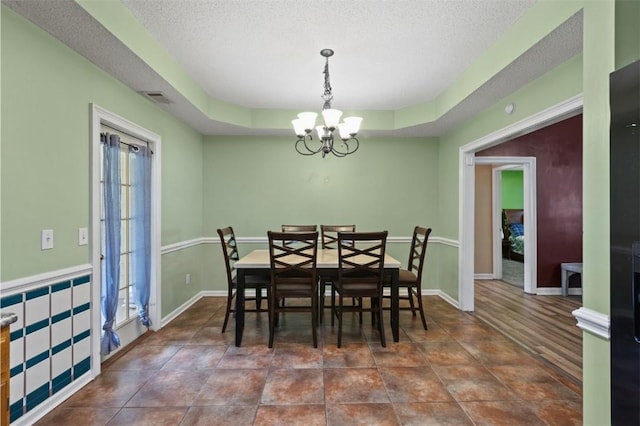 1417 Ridge Rd, Opelika, AL 36801 - dining area with a chandelier and a textured ceiling