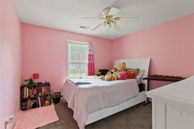 1417 Ridge Rd, Opelika, AL 36801 - carpeted bedroom with ceiling fan and a textured ceiling