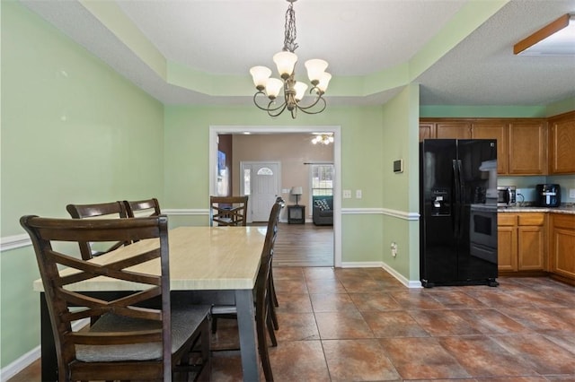 1417 Ridge Rd, Opelika, AL 36801 - dining area with a chandelier and dark tile patterned flooring