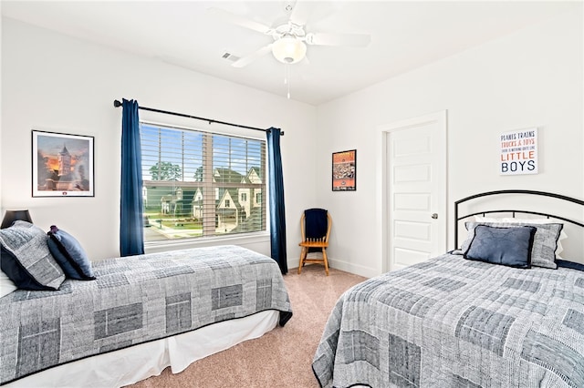 bedroom with ceiling fan, visible vents, and baseboards