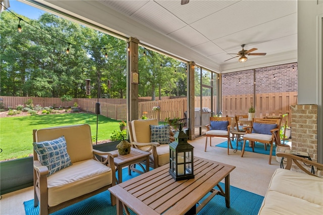 sunroom with a ceiling fan