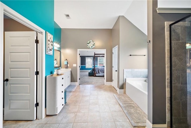 300 Holland Loop, Smiths Station, AL 36877 - full bathroom with a bath, vanity, a stall shower, tile patterned flooring, and ensuite bathroom