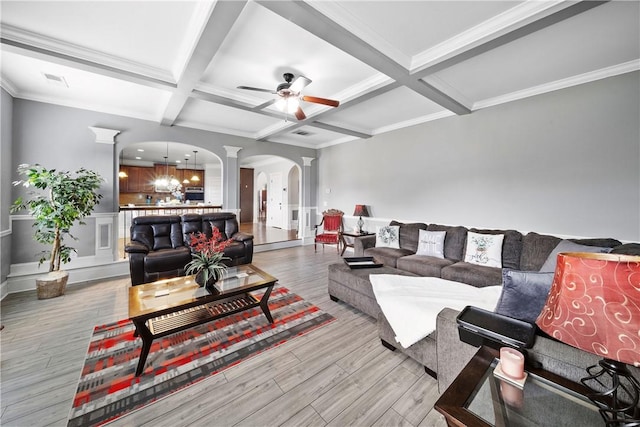 300 Holland Loop, Smiths Station, AL 36877 - living room with ornate columns, arched walkways, coffered ceiling, ceiling fan, and beamed ceiling