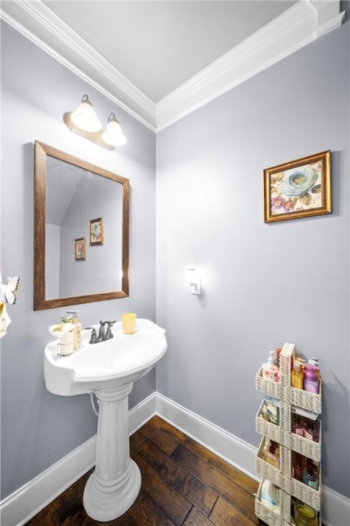 300 Holland Loop, Smiths Station, AL 36877 - bathroom featuring ornamental molding and wood-type flooring