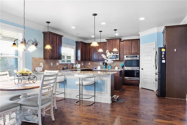 300 Holland Loop, Smiths Station, AL 36877 - kitchen with a chandelier, dark wood-style flooring, backsplash, ornamental molding, and recessed lighting