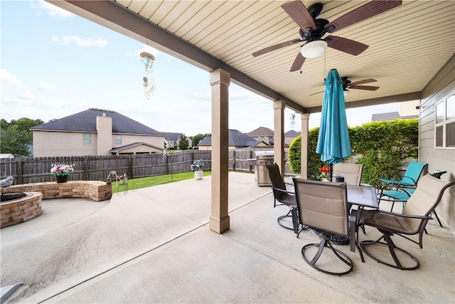 300 Holland Loop, Smiths Station, AL 36877 - fenced backyard with a patio area, a ceiling fan, and outdoor dining area