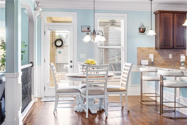 300 Holland Loop, Smiths Station, AL 36877 - dining area with crown molding, dark wood-style flooring, and a chandelier